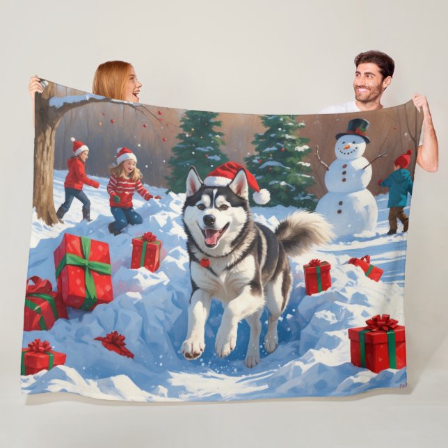 Siberian Husky Running in Snow with Christmas Hat Fleece Blanket (In Situ)