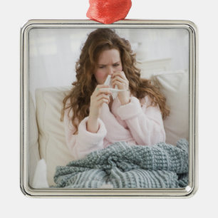 Sick woman on couch metal ornament