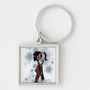 Side view of woman listening music keychain