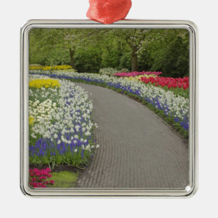 Sidewalk pathway through tulips and daffodils, 2 metal ornament