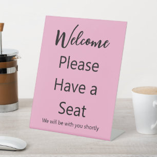 Signe De Table Bienvenue S'il vous plaît avoir un siège rose et n