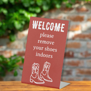 Signe De Table Enlever les chaussures Bottes de cowboy Location d