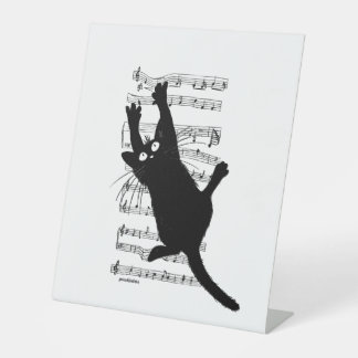 Signe De Table Le chat est accroché à des notes musicales