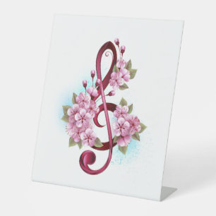 Signe De Table Notes de clef musicale en treble avec des fleurs S