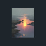 Silhouette Couple Sunset Stream Reflection Canvas Print<br><div class="desc">Two silhouetted figures hold hands as they walk along a shallow stream bathed in the last warm light of sunset. The sky burns in peach, rose, and deep orange, perfectly mirrored on the still water below, while soft mist and tall grasses fade into cool gray-blue distance. Delicate rays of golden...</div>