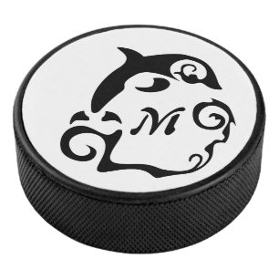 Silhouette Dolphin in a Black Sea Wave Hockey Puck