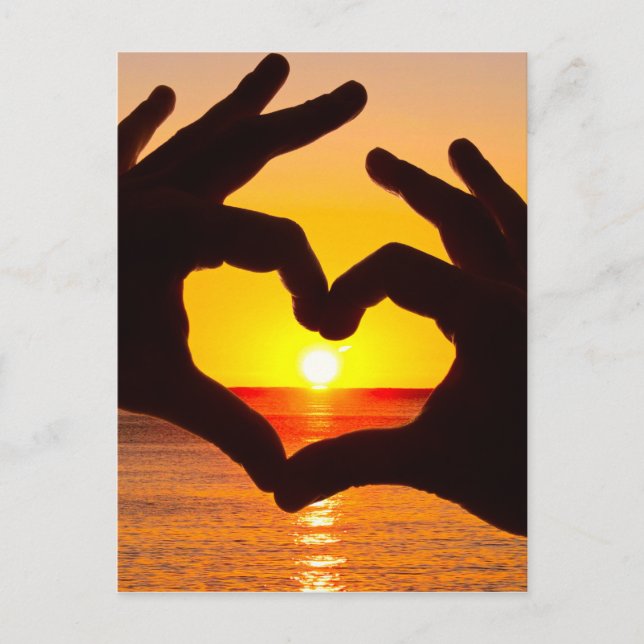 Silhouette hand in heart shape and sunrise over th postcard (Front)