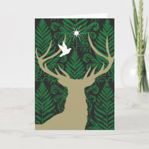 Silhouette of a deer, a dove and a star against a holiday card