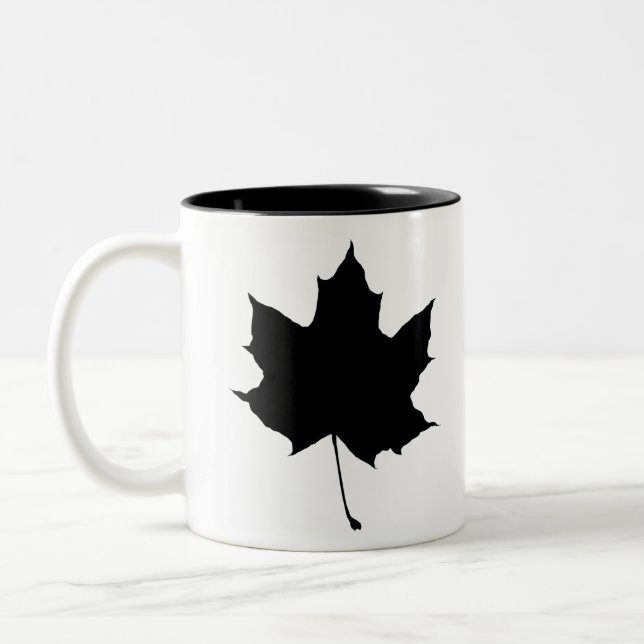 Silhouette of a maple leaf Two-Tone coffee mug (Left)