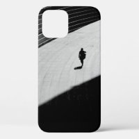 SILHOUETTE OF A PERSON WALKING ON GRAY CONCRETE FL