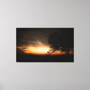 Silhouette of a Tree at Sunset Canvas Print