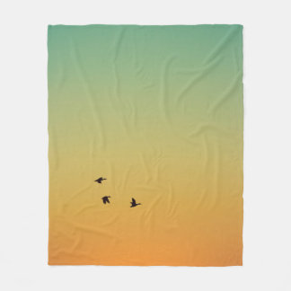 SILHOUETTE OF BIRDS FLYING DURING SUNSET FLEECE BLANKET