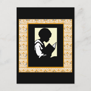 Silhouette of boy reading postcard