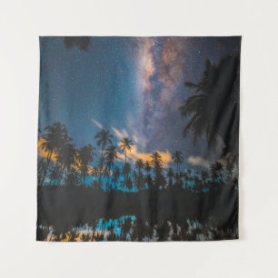Silhouette of coconut trees reflected on body of w tapestry