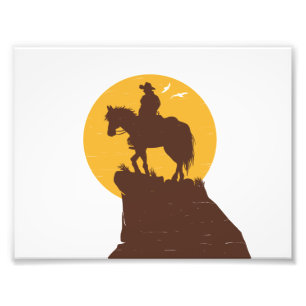 Silhouette of cowboy riding horse at sunset photo print