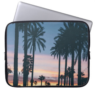 Silhouette of houses beside palm trees and pathway laptop sleeve