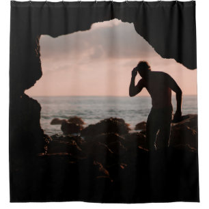 Silhouette of man in cave