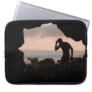 Silhouette of man in cave laptop sleeve