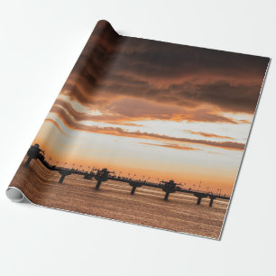 SILHOUETTE OF PEOPLE ON BEACH DURING SUNSET WRAPPING PAPER
