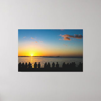 Silhouette of People Watching Golden Sunset over O Canvas Print