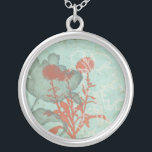 Silhouette of Red Flowers on Teal Background Silver Plated Necklace<br><div class="desc">Three red flowers contrast against a teal background in this painting by Megan Meagher. A silhouette of another flower leans in from the left of the print. A simple piece with a lot going on. This would make nice gift for a friend or loved out who enjoys art!</div>