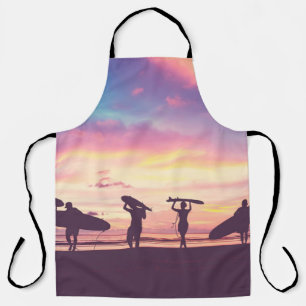 Silhouette Of surfer people carrying their surfboa Apron