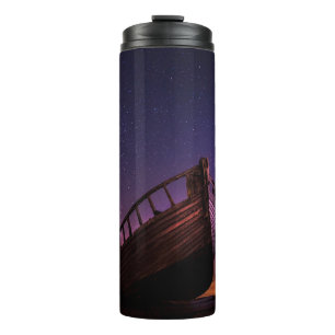 SILHOUETTE PHOTOGRAPHY OF SAILING BOAT ON BODY OF THERMAL TUMBLER