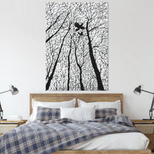 Silhouetted Ravens in the Winter Trees Canvas Print
