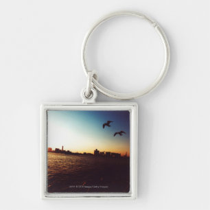 Silhouetted Tokyo Bay skyline at sunset Keychain