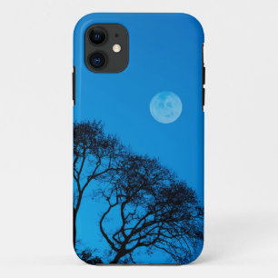 Silhouetted trees and full moon iPhone 11 case