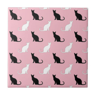 Silhouettes Of Black and White Cats On Pink Tile