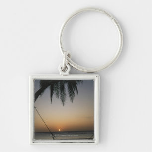 Silhuetted empty hammock at sunset keychain