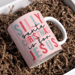 Silly Santa Christmas Is For Jesus Cute Pink Coffee Mug<br><div class="desc">Introducing our adorable Silly Santa Christmas Is For Jesus Retro Pink Coffee Mug! This charming mug boasts a delightful snowflake typography design in a retro palette of pink, red, and teal. Perfect for sipping your favourite holiday beverages, this cute and festive mug will add a touch of cheerful charm to...</div>