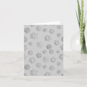 Silver 3-d snowflakes on a silver background holiday card