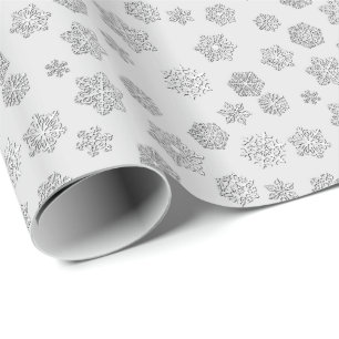 Silver 3-d snowflakes on a silver background wrapping paper