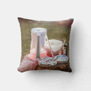 Silver-and-blue floral ceramic plates and pitcher throw pillow