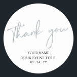 Silver Brush Script Birthday Party Thank you Favou Classic Round Sticker<br><div class="desc">This simple custom thank you sticker will add stylish detail to your special day. This design features modern silver script lettering " Thank you" with custom text. Matching 21st birthday invitations and party supplies are available in my shop BaraBomDesign.</div>