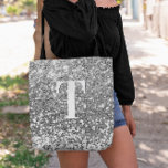 Silver Faux Glitter Bokeh Sparkles Monogram Tote Bag<br><div class="desc">A modern bold single letter monogram in white with a black drop shadow. The font size, colour and style are customizable. The background is a faux silver grey glitter with sparkly spots or bokeh. Move or delete the tiny faux sparkle graphic images. Silvery grey gift for a bridesmaid or other...</div>