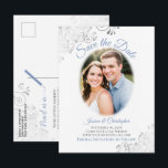Silver Frills w/ Photo Blue Wedding Save the Date Announcement Postcard<br><div class="desc">This beautiful postcard is designed to give your friends and family advance notice of your upcoming wedding. It features a simple yet elegant design with light blue and grey text on a white background, and your photo in an oval frame surrounded by frilly silver grey faux foil curls and swirls....</div>