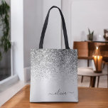 Silver Glitter Monogram Name Luxury Girly Tote Bag<br><div class="desc">Silver Faux Sparkle and Dripping Glitter Metallic Stainless Steel Foil Elegant Monogram Book Bag. This Book Bag can be customized to include your initial and first name and given as a gift for Christmas,  Sweet 16 Birthday,  Bridal Shower or a Wedding.</div>