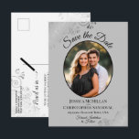 Silver Grey Fancy Wedding Save the Date Oval Photo Announcement Postcard<br><div class="desc">This beautiful save the date postcard is designed to give your friends and family advance notice of your upcoming wedding. It features a simple yet elegant design with black text on a grey background, and your photo in an oval frame surrounded by frilly silver grey faux foil curls and swirls....</div>