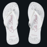 Silver Lace & Dusty Rose Script The Bride Wedding Flip Flops<br><div class="desc">Dance the night away with these beautiful wedding flip flops. Designed for the bride, they feature a simple yet elegant design with dusty rose or mauve pink script lettering on a white background and fancy silver grey lace curls and swirls. Beautiful way to stay fancy and appropriate while giving your...</div>