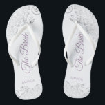 Silver Lace & Lavender Script The Bride Wedding Flip Flops<br><div class="desc">Dance the night away with these beautiful wedding flip flops. Designed for the bride, they feature a simple yet elegant design with dusty purple or lavender script lettering on a white background and fancy silver grey lace curls and swirls. Beautiful way to stay fancy and appropriate while giving your feet...</div>