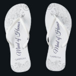 Silver Lace Navy on White Maid of Honour Wedding Flip Flops<br><div class="desc">These beautiful wedding flip flops are a great way to thank and recognize your Maid of Honour while saving her feet at the same time. Features an elegant design with silver grey lace on a white background and fancy navy blue coloured script lettering. The test reads Maid of Honour with...</div>