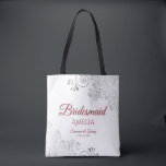 Silver Lace Red & White Bridesmaid Wedding Tote Bag<br><div class="desc">These Bridesmaid tote bags are designed as favours or gifts for wedding bridesmaids. Great swag bag to fill with favours and gifts. The simple yet elegant design features silver grey lace in the corners with fancy script lettering. There is space for her name, as well as the names of the...</div>