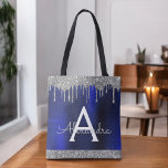 Silver Navy Blue Glitter Sparkle Elegant Monogram Tote Bag<br><div class="desc">Luxury Silver and Navy Blue Faux Sparkle and Dripping Glitter Metallic Stainless Steel Foil Elegant Monogram Book Bag. This Book Bag can be customized to include your initial and first name and given as a gift for Christmas, Sweet 16, 18th, 21st, 30th, 40th, 50th, or 60th Birthday, Bridal Shower or...</div>