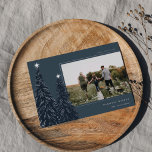 Silver Pine | Elegant Christmas Photo Foil Holiday Card<br><div class="desc">A modern and elegant Christmas holiday card design featuring a horizontal photo on a navy blue background adorned with pine trees trimmed with silver foil and topped with stars. Personalize with your custom holiday greeting,  family name and the year.</div>