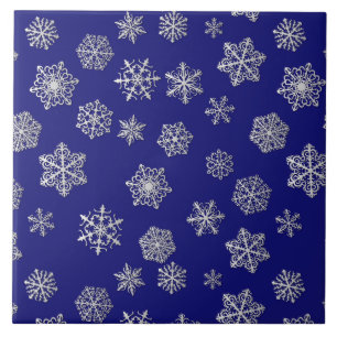 Silver snowflakes on a dark blue background tile