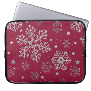 Silver snowflakes on dark red laptop sleeve
