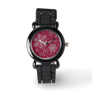 Silver snowflakes on dark red watch